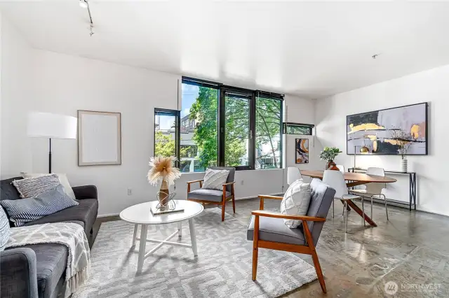 Spacious, bright and airy, this modern Capitol Hill condo provides an in-city retreat with large windows and aesthetically pleasing concrete floor.