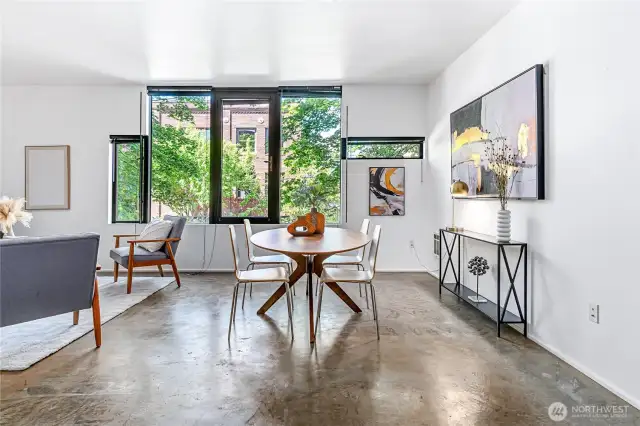 Spacious, bright and airy, this modern Capitol Hill condo provides an in-city retreat with large windows and aesthetically pleasing concrete floor.