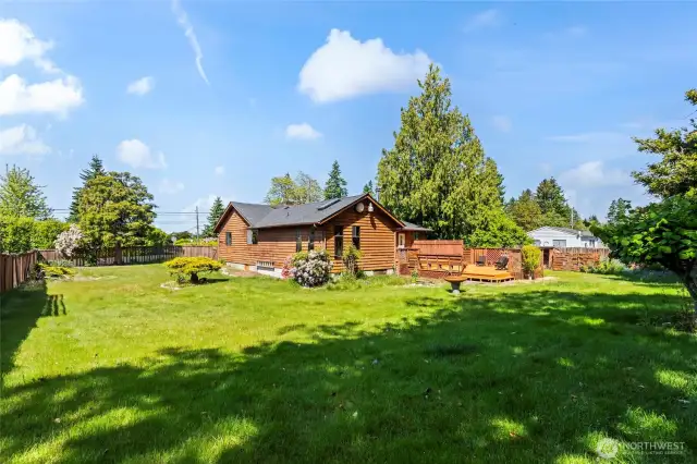 The yard is a perfect blend of landscaped and some woodsy areas in back.