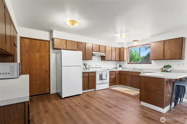 Lots of storage in all the cabinets, access to the garage and laundry room off the kitchen.