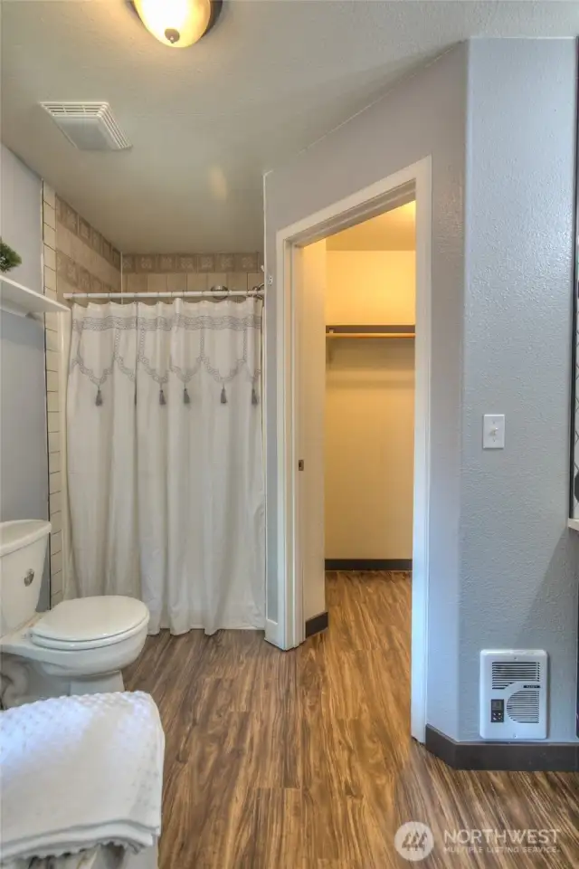 Walk in closet and tiled shower
