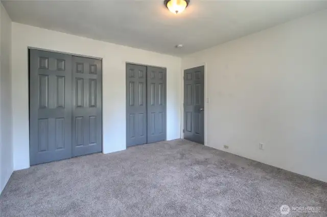Double closets with storage behind. Storage area covers the whole back wall   of the double closets