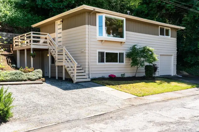 New exterior paint in light, neutral colors creates a fresh look on this charming home