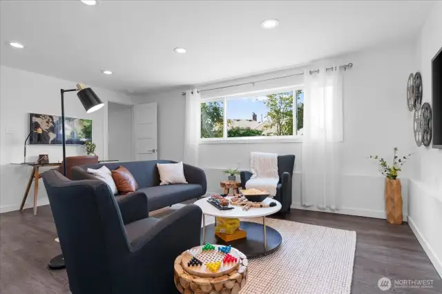 Lower level family room with oversized window, is perfect for a home theater