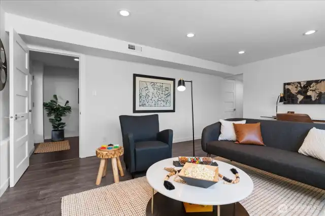 Low maintenance luxury vinyl flooring continues throughout  lower level