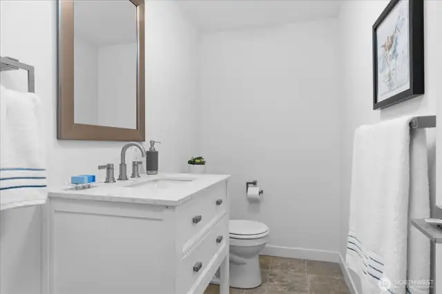 Lower level 1/2 bath, could be converted to a 3/4 bath offering a multitude of options for future rental income