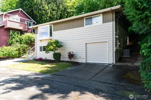 A one car garage with new garage door, and  two car driveway, plus two additional parking spots allow for off-street parking for visitors