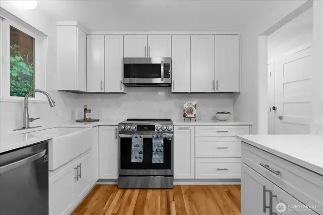 Ample cabinets and counter space in this nicely sized, remodeled kitchen