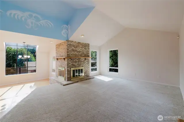 As you enter, a sense of freedom greets you with the cathedral ceilings in the family room. A double-sided fireplace adds serenity, flowing into the light-filled dining room on the left. This blend of space and light makes the home a comforting sanctuary.