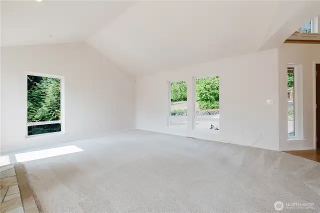 Step into a family room designed to be the heart of your home, where comfort and style come together effortlessly. Sunlight pours in through generous windows, flooding the room with abundant natural light that highlights its open layout. this versatile room adapts to your lifestyle. With its welcoming atmosphere.