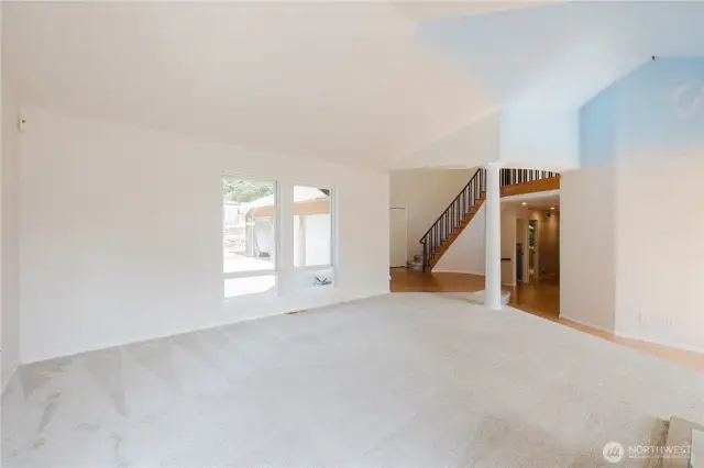 View from the fireplaces looking towards the rotunda and hallway towards 2 bedrooms, full bath and laundry room.