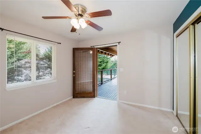 View of bedroom 1 with access to the outer deck