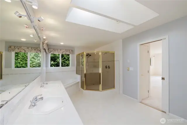 A spacious 5-piece primary bath epitomizes luxury and comfort, offering a private oasis at home. It typically includes a double vanity for ample space, a large soaking tub for relaxation, a separate walk-in shower,