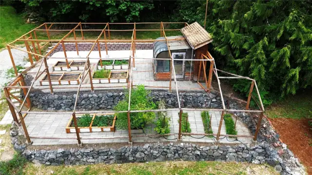 Transform your gardening dreams into reality with this ready-to-use raised garden. Fully netted for protection and equipped with two gated entrances, it offers both accessibility and security. The included greenhouse provides an ideal space for nurturing your plants. With ample room for expansion, you have the perfect setting to cultivate and grow your dream garden.