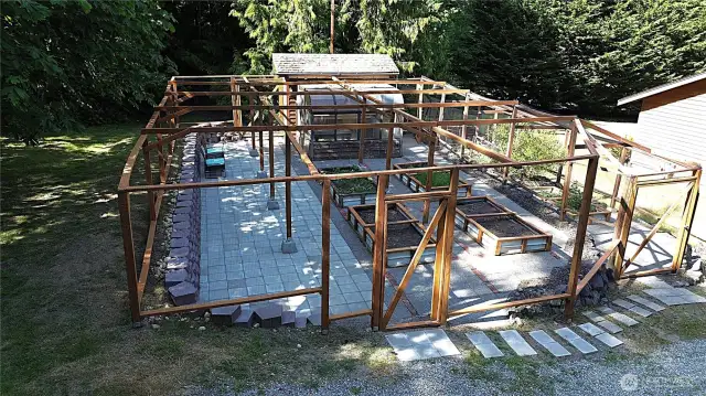 fully netted area can protect plants from pests, allowing them to thrive. Dedicate spaces for herbs, vegetables, and pollinator-attracting flowers. With two gates, enjoy an easy flow making your garden a personal haven.