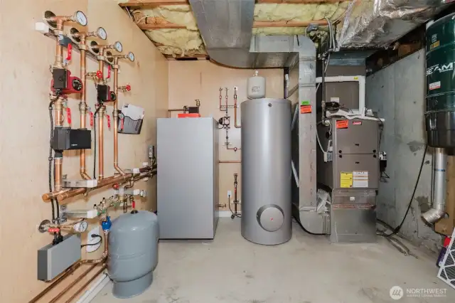 A modern boiler for radiant flooring ensures even heat distribution and optimal temperatures with minimal energy use. Upgrading to a high-efficiency forced air furnace improves airflow and cuts energy costs, offering reliable warmth in colder months. An inline vacuum system provides centralized, effective cleaning. These updates enhance home comfort and sustainability.