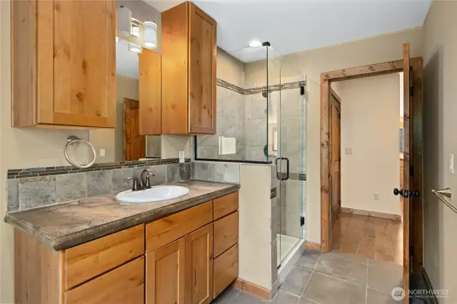 Walk in shower and great cabinet space.