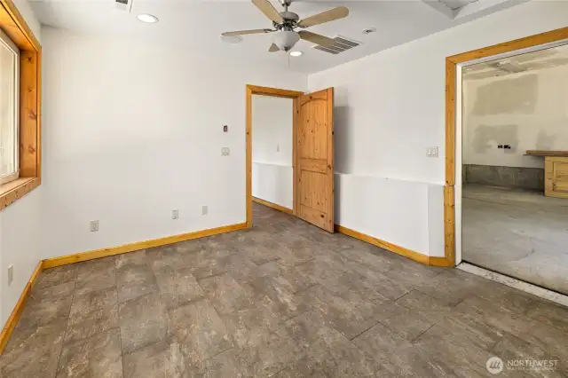 Additional finished room downstairs off the garage.