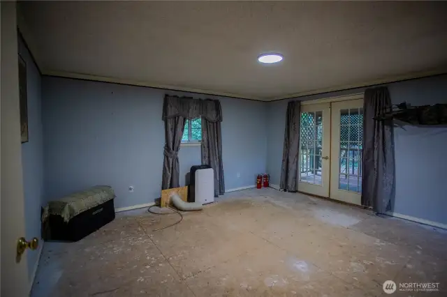 large main bedroom with French doors to private covered porch