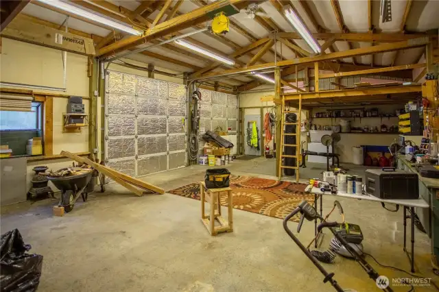 Big double doors, cement floor, storage lofts