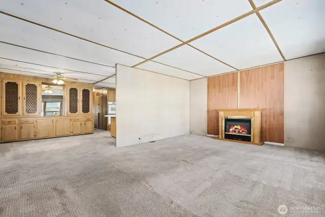 Living room opens to the dining room and kitchen.