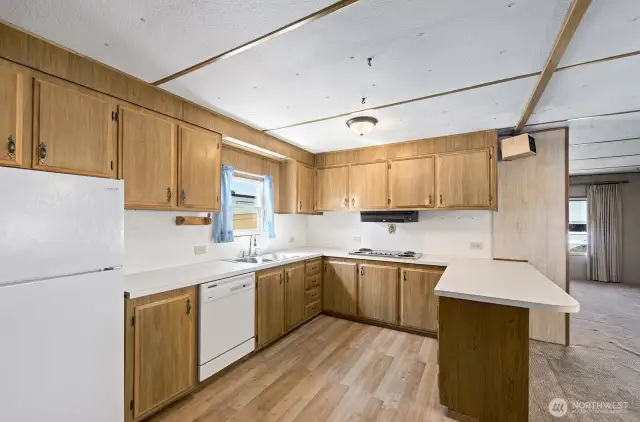 Kitchen opens to the dining room and features tons of counter space.