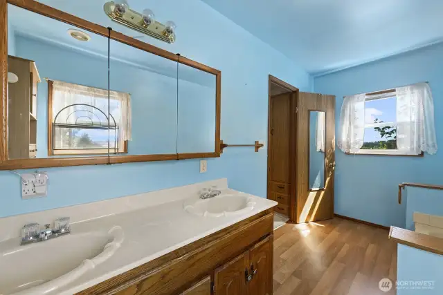Primary bathroom is roomy and comfortable for two people at one time.