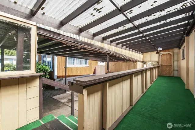 Covered front porch area allows you to enjoy the out of doors during rainy weather.