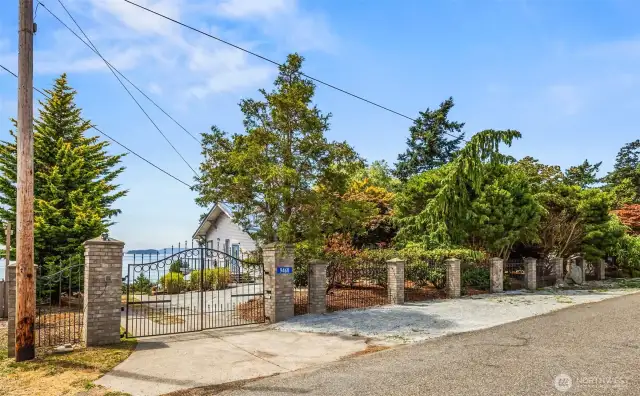 Welcome to the East Gate — your entry point to this historic Samish Island estate. The gated drive leads you past the house and down to the private boat ramp and the original cannery, nestled along 110 acres of deeded tidelands.