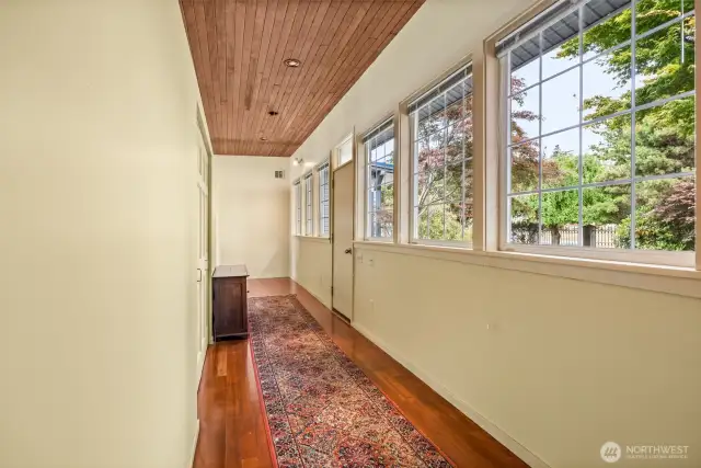 As you enter through the front door, you're greeted by well-preserved original hardwood floors, abundant natural light from large windows, and plenty of built-in storage—blending vintage character with everyday comfort.