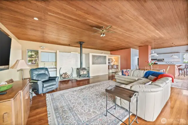 The inviting living room features a classic wood-burning fireplace to keep you warm on chilly island nights, along with a built-in wet bar—perfect for entertaining or relaxing with a view.