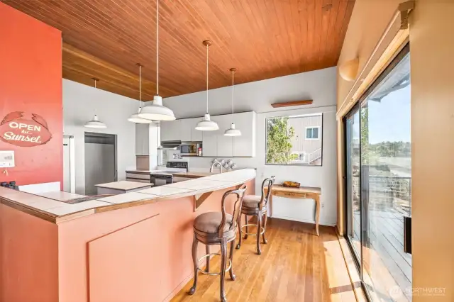 The kitchen eating bar provides plenty of space for casual meals, morning coffee, or gathering with guests—convenient and comfortable.