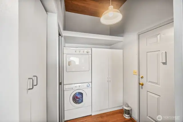 Just off the kitchen, the utility room offers convenient access to a 3/4 bathroom on the left and a door to the deck, driveway, and private boat ramp leading down to the historic cannery—blending function with easy outdoor access.