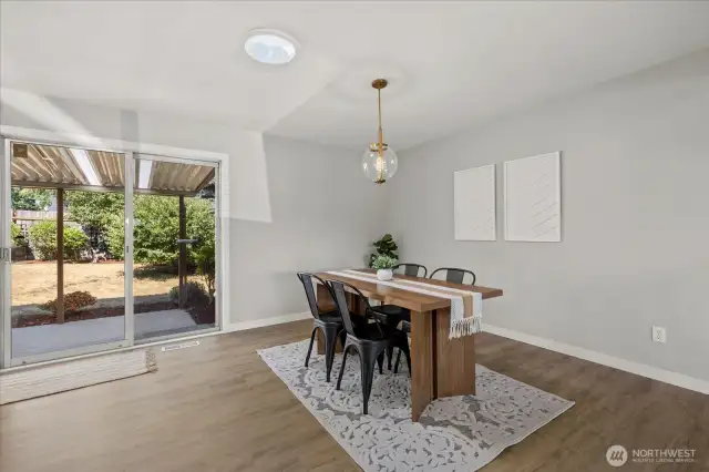 Enjoy effortless flow from dining to covered patio—perfect for indoor-outdoor living