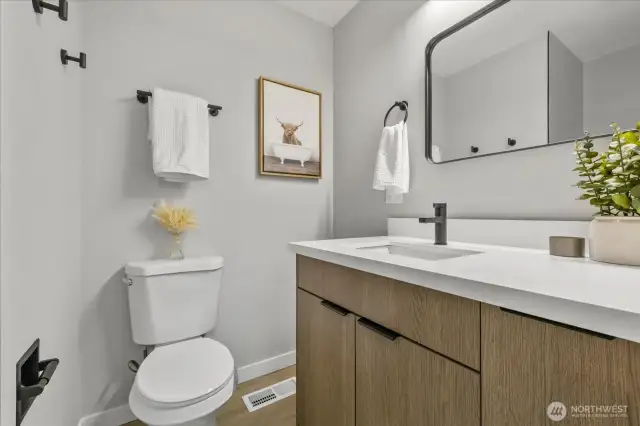 Updated primary bathroom featuring sleek, modern finishes