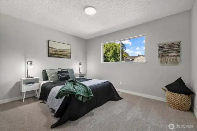 Bedroom 2. All bedrooms feature new carpet and a fresh, modern feel