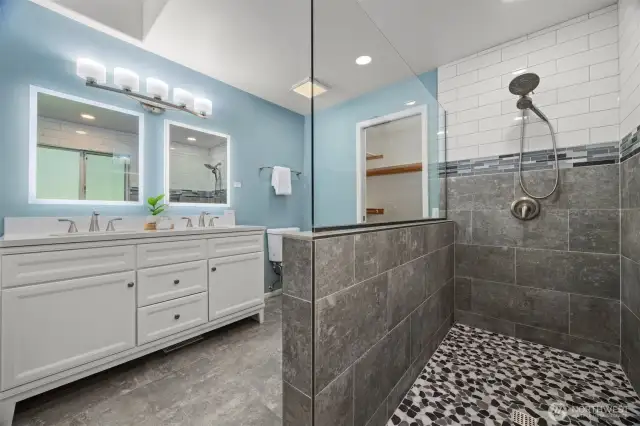 Heated floors, double vanity, plus a large walk-in closet off the bathroom - as well as a linen closet and a traditional closet.