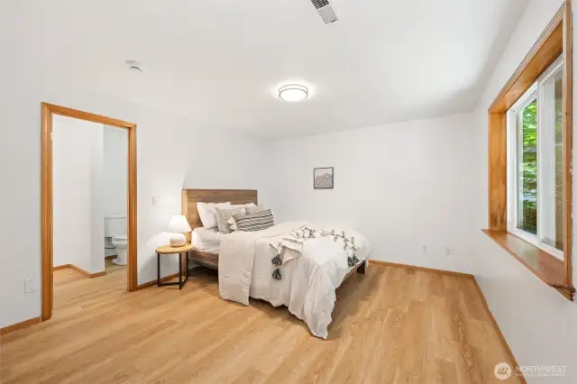 Downstairs, enjoy two more bedrooms, a spacious family room, and an additional 575 sq ft of unfinished flex space currently set up as a home gym.