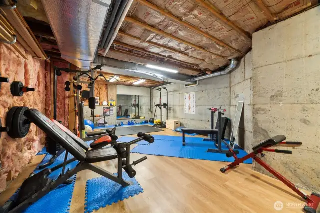 The unfinished 575 sq ft room is being used as a home gym.