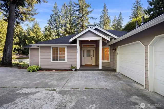 An inviting covered front entry. Come see the quiet privacy and seclusion offered in this southside gem.