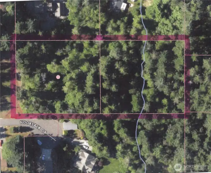 Two 1+ acre lots on a paved street with power and water in the street.