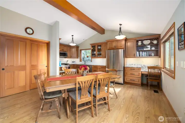 Open concept dining and kitchen with large pantry for additional storage.