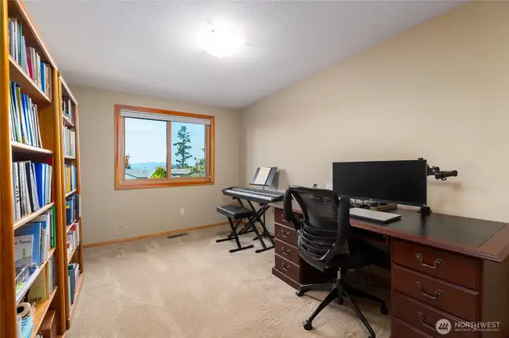 4th bedroom on the main floor which is currently being utilized as an office. It offers views of the water and islands!