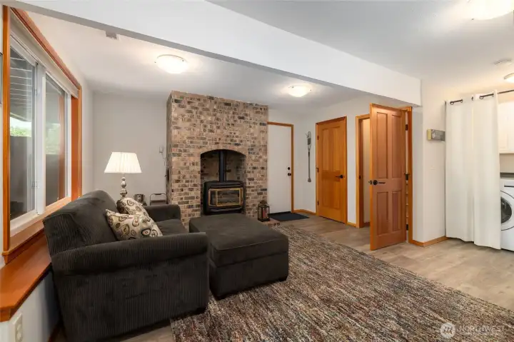 Downstairs family room with gas fireplace and lots of storage.