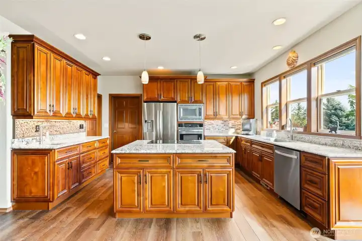Kitchen with upgrades throughout.