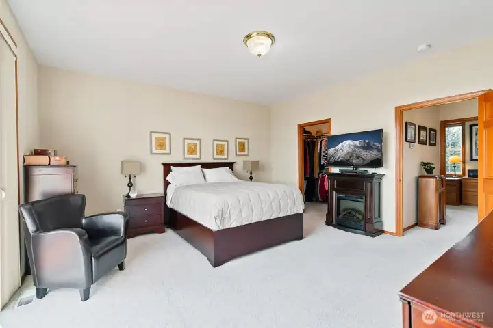 Large primary bedroom with a walk in closet.