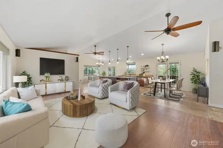 Open great room with seamless flow to kitchen and dining areas featuring surround sound system.