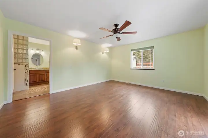 Generous primary suite with double-door entry and French doors to patio.