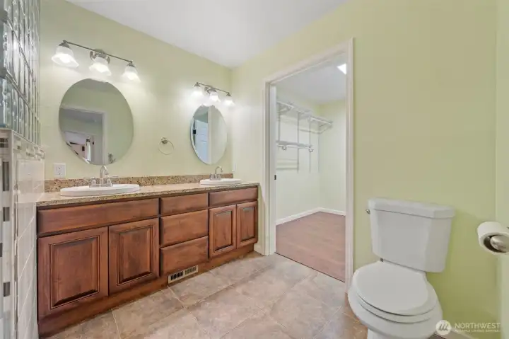 Custom primary bath with walk-in closet and thoughtful design.