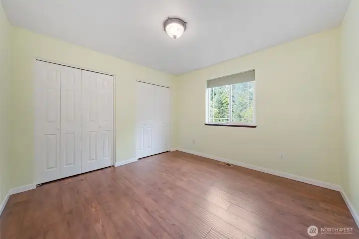 Comfortable secondary bedroom with peaceful views.